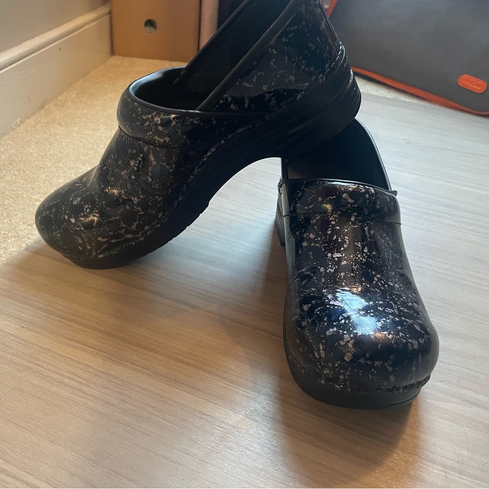 Dansko patent leather clogs.
